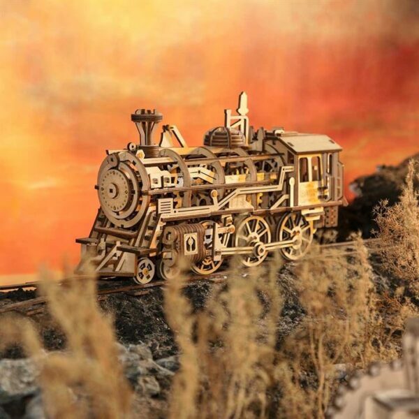 Une maquette puzzle 3d d'une locomotive à vapeur dans le désert.