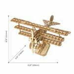 Un puzzle 3D en bois d'un biplan avec mesures.