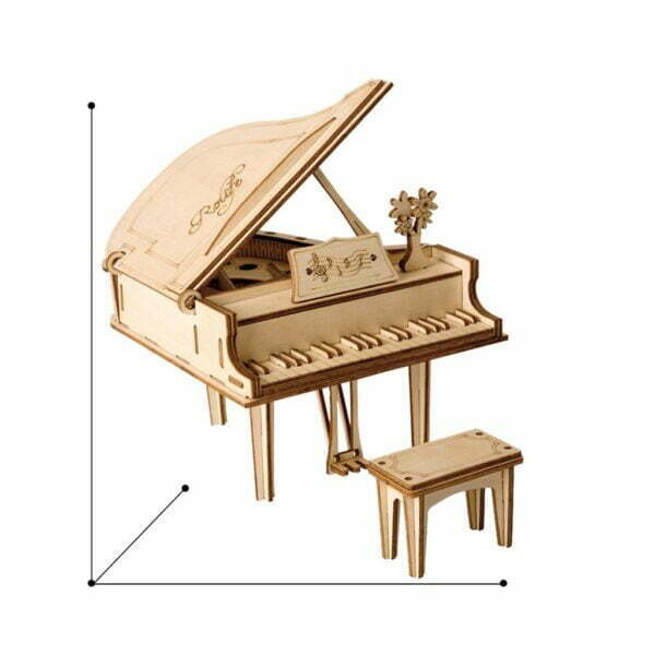 Un puzzle 3d en bois d'une maquette de piano à queue avec un tabouret.