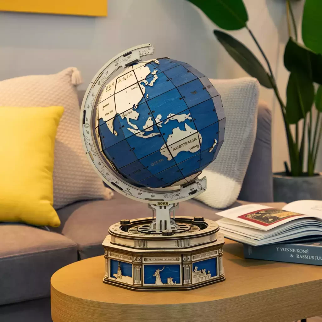 Un modèle de puzzle 3d d'un globe terrestre géant sur une table dans un salon.