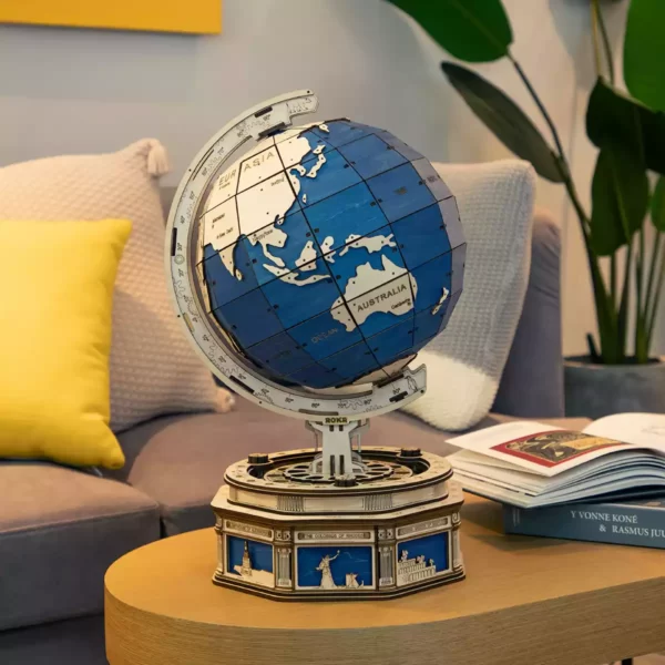 Un modÃ¨le de puzzle 3d d'un globe terrestre gÃ©ant sur une table dans un salon.
