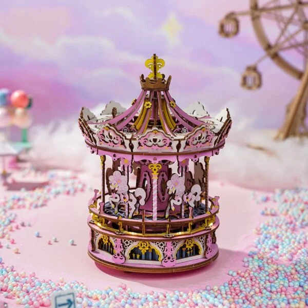 Un Carrousel musical enchanté de puzzfever sur fond rose.